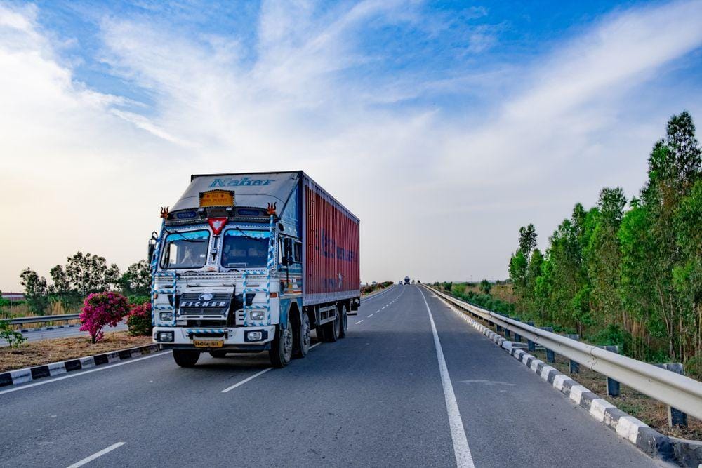 Truck loaded with wrapped furniture and boxes for an interstate long-distance move